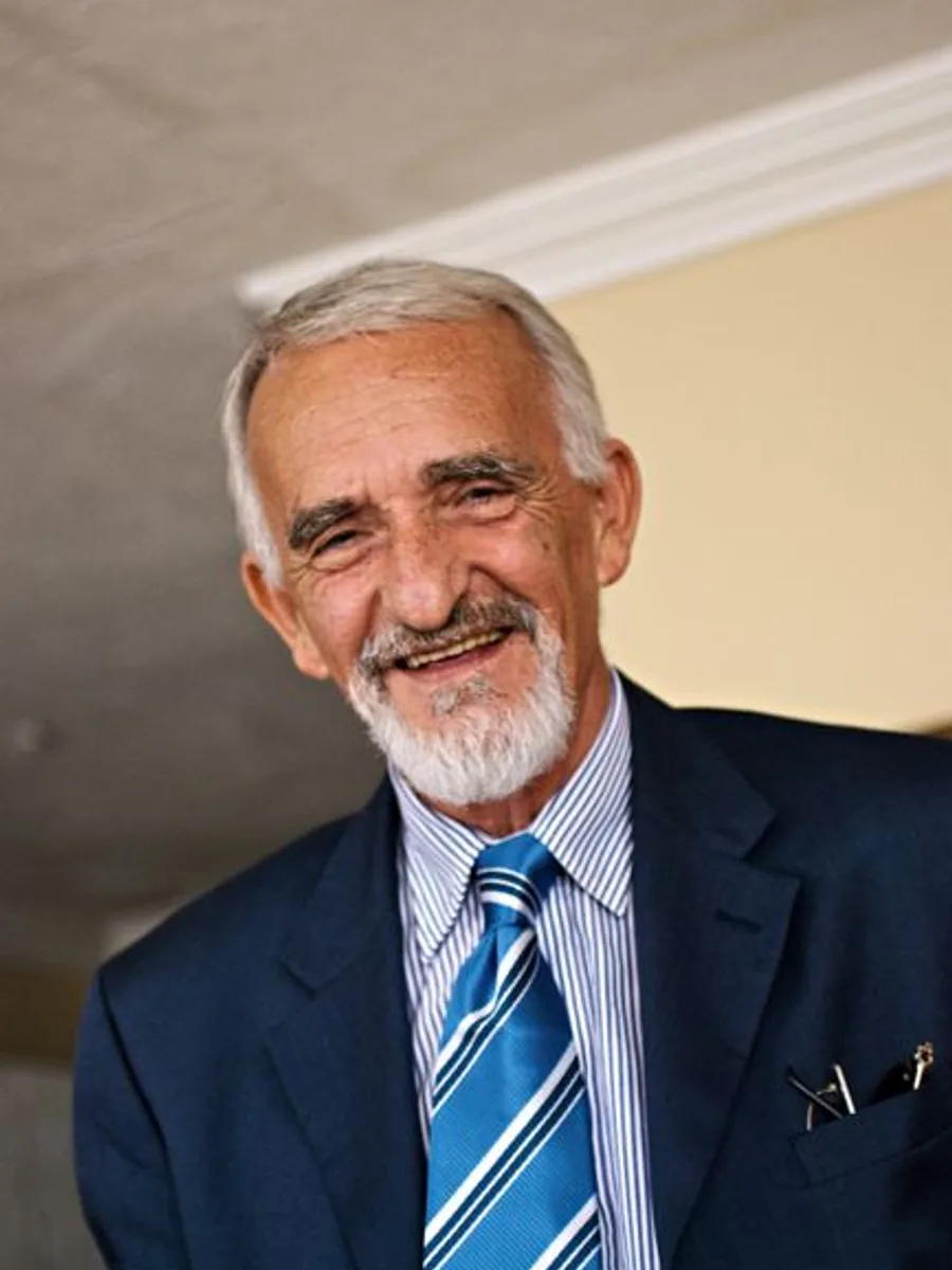 Giuseppe, the founder, smiling in the dining room
