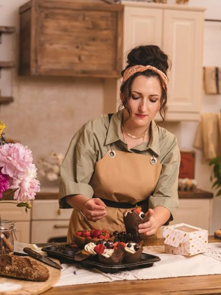 Lucia, the pastry chef, at her station in an apron